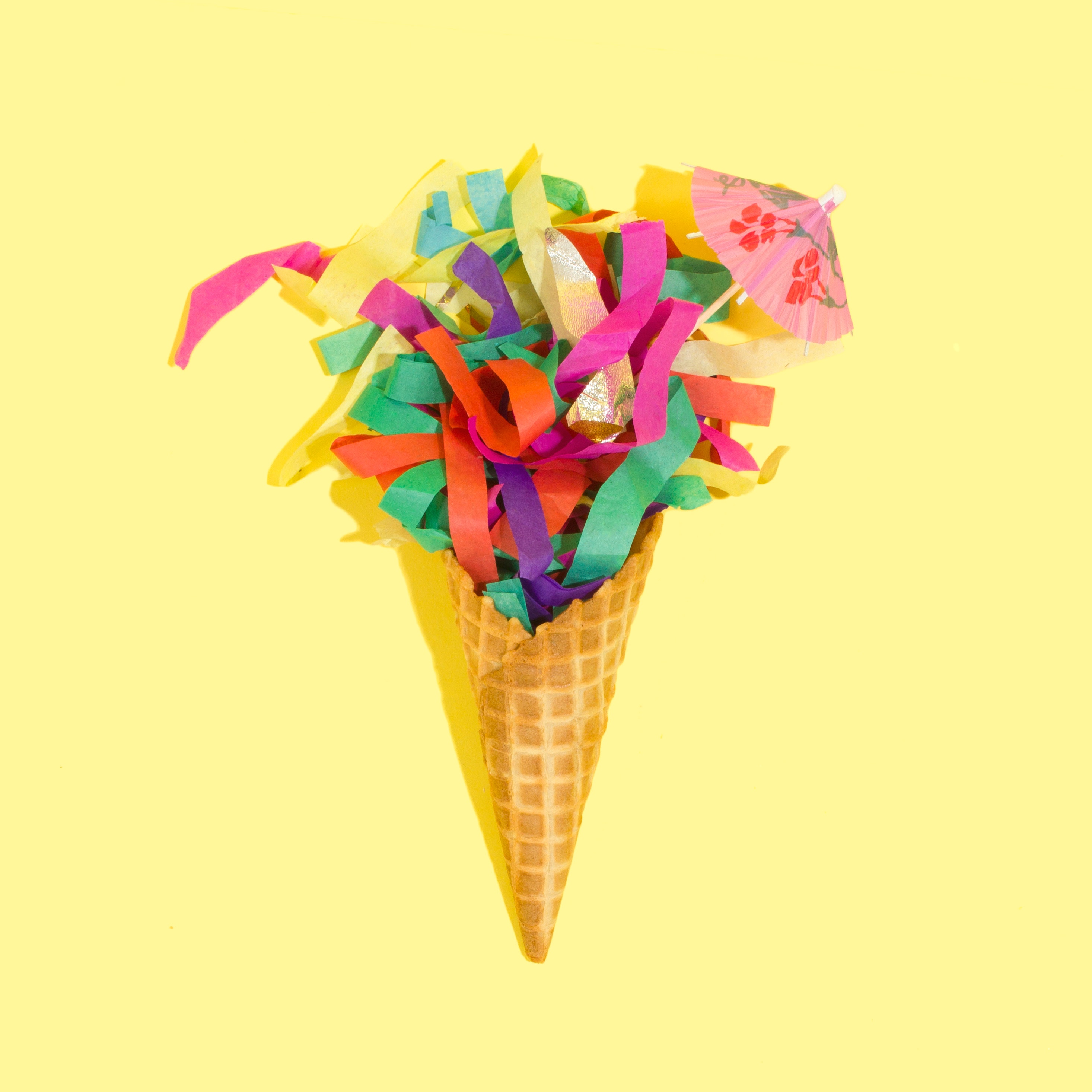 Ice cream cone with party ribbons. Photo by Amy Shamblen on Unsplash